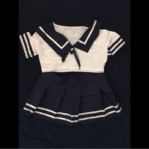 Navy blue and white sailor crop top and skirt set.